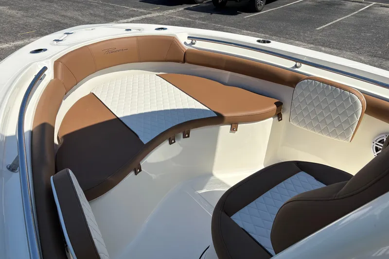 Slide: The Image of Interior of 2027 Pioneer 202 Islander boat with brown and white seating. - 25