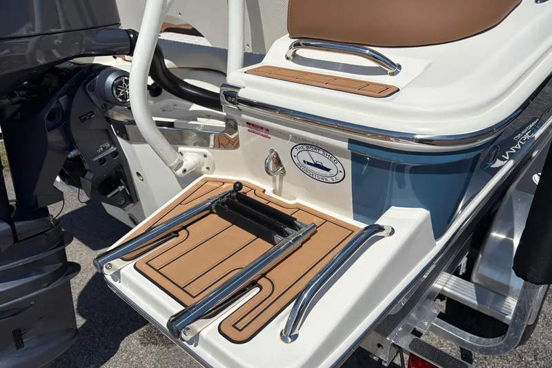 Slide: The Image of 2027 Pioneer 202 Islander boat with swim platform and ladder, featuring sleek design and modern features. - 9