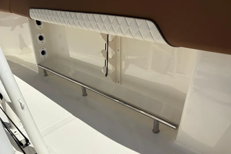 Slide: The Image of Interior view of 2027 Pioneer 202 Islander boat with cushioned seating and stainless steel railing. - 15