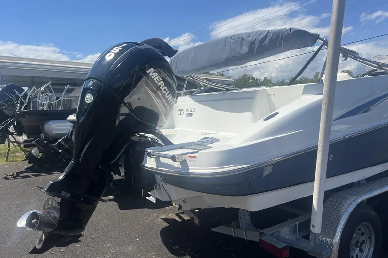Slide: The Image of 2017 Tahoe 2150 boat with Mercury outboard motor on a trailer. - 3