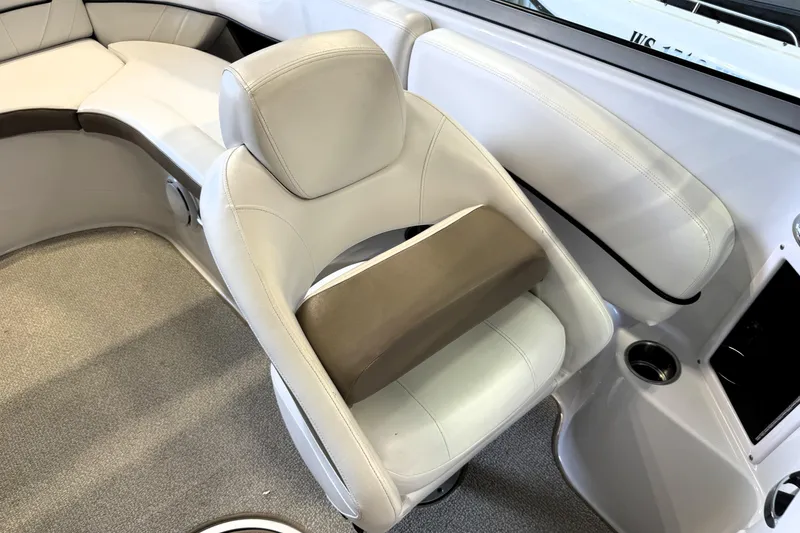 Slide: The Image of 2008 Four Winns H240 boat interior with white leather seating and cup holder. - 17