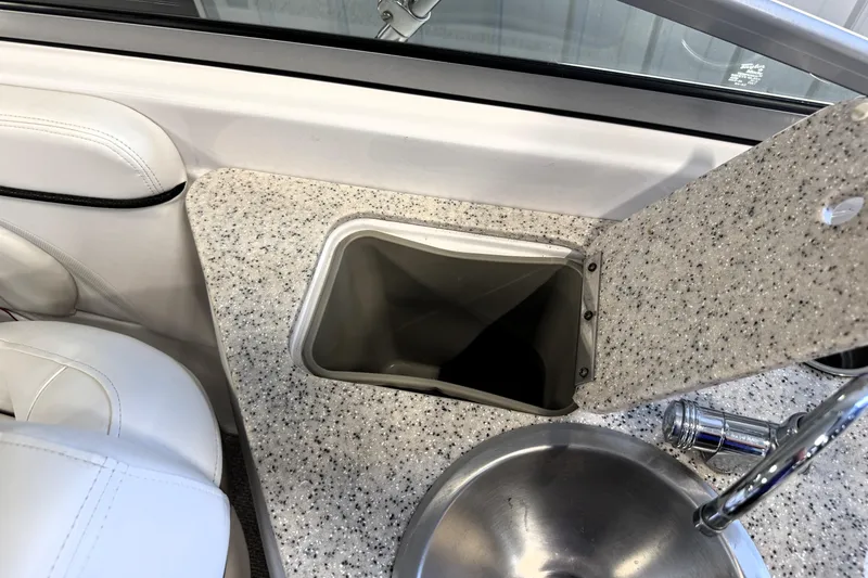Slide: The Image of 2008 Four Winns H240 boat interior with sink and countertop detail. - 19