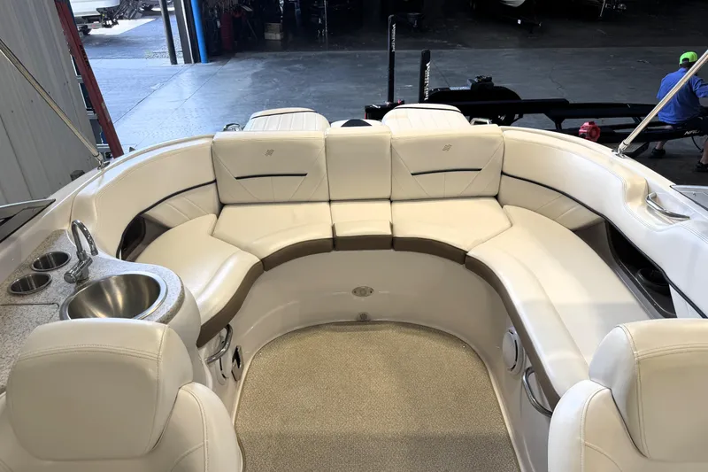 Slide: The Image of Interior of 2008 Four Winns H240 boat with white seating and built-in sink. - 10