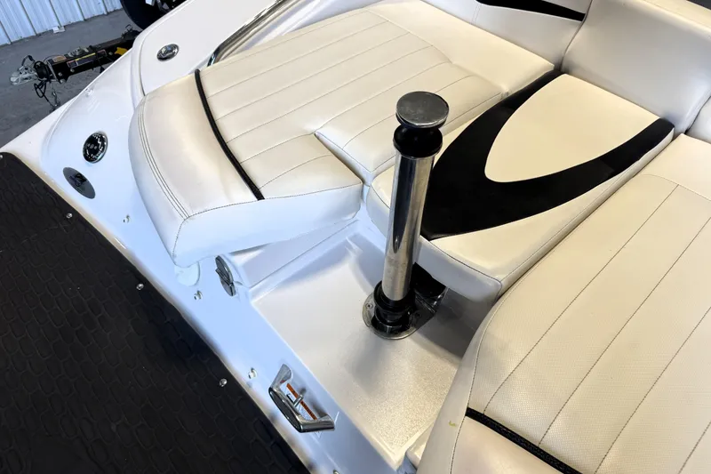 Slide: The Image of 2008 Four Winns H240 boat interior with white seating and chrome details. - 20