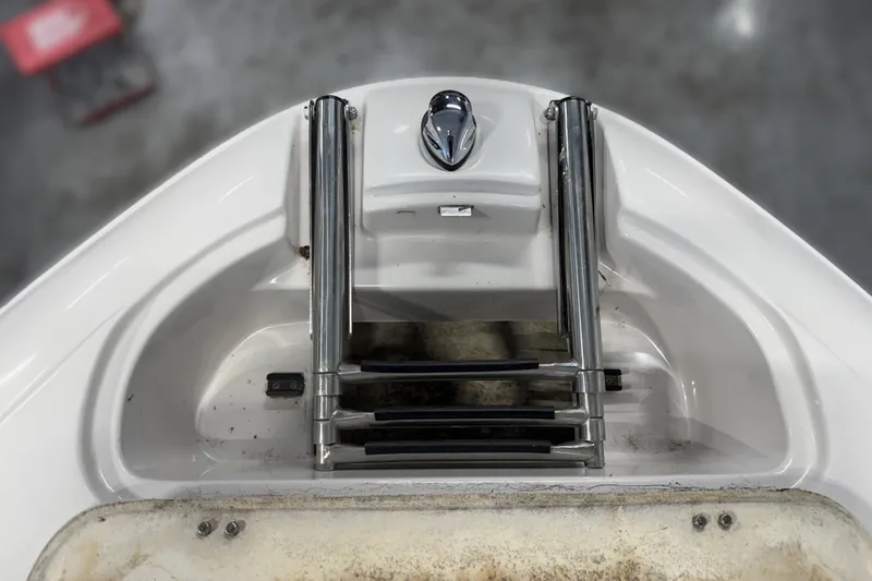 Slide: The Image of 2008 Four Winns H240 boat ladder and handle detail, showcasing stainless steel construction. - 36