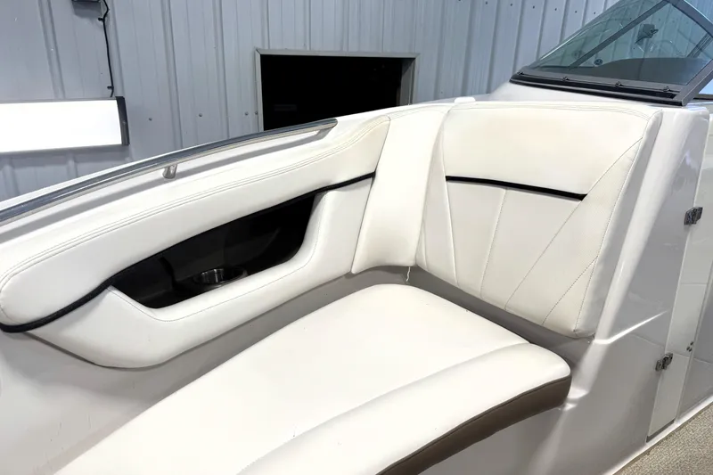 Slide: The Image of 2008 Four Winns H240 boat interior with white cushioned seating and sleek design. - 7
