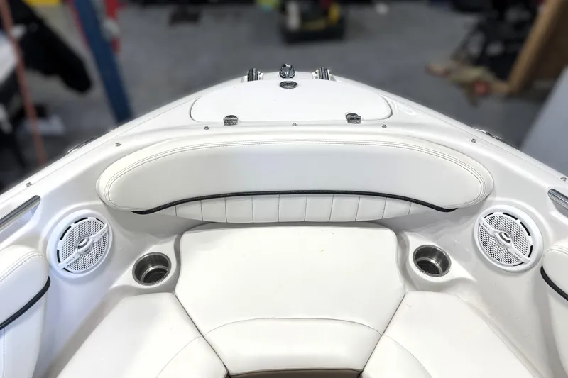 Slide: The Image of Interior of 2008 Four Winns H240 boat with white seating and built-in speakers. - 35