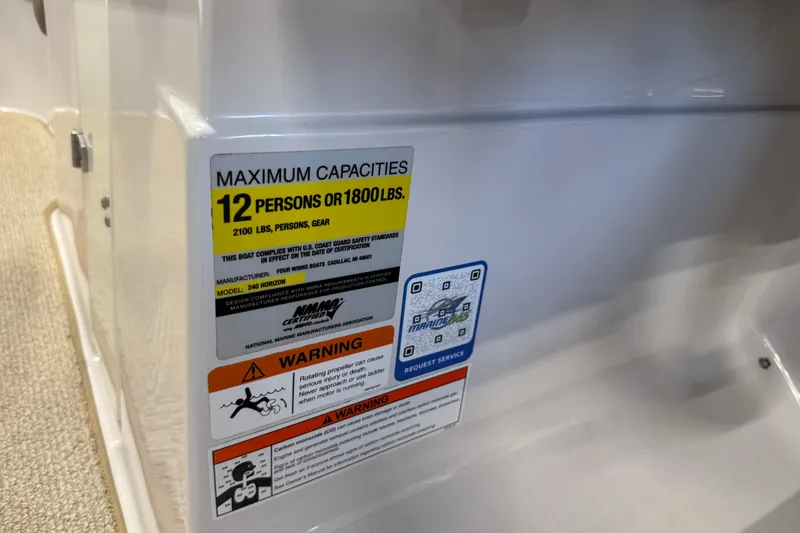 Slide: The Image of Capacity label on 2008 Four Winns H240 boat, max 12 persons or 1800 lbs. - 21