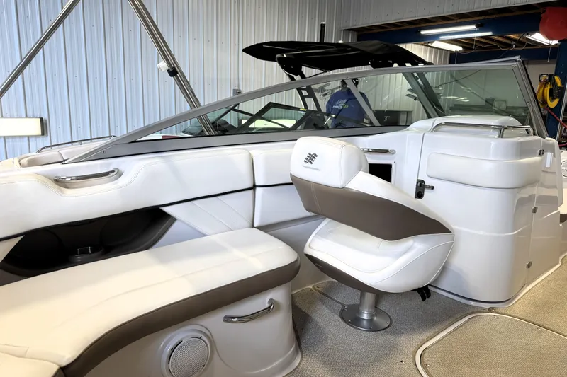 Slide: The Image of Interior of a 2008 Four Winns H240 boat with white and gray seating. - 13