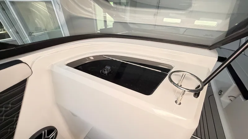 Slide: The Image of The image shows the cockpit of a Sea Ray SPX 210 boat with modern controls. - 46