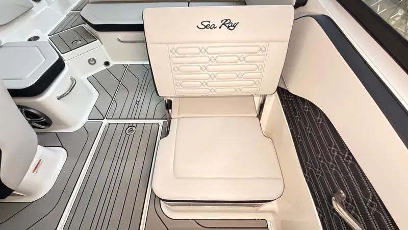 Slide: The Image of Interior of a Sea Ray SPX 210 boat with sleek, upholstered seating and modern design. - 32