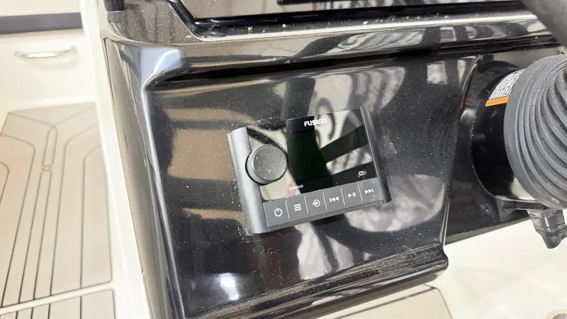 Slide: The Image of Fusion audio system on the console of a Sea Ray SPX 210 boat. - 37