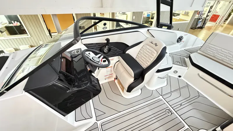 Slide: The Image of Interior of a Sea Ray SPX 210 boat with modern helm and sleek seating. - 34
