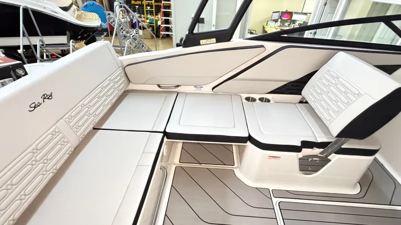 Slide: The Image of Interior of a Sea Ray SPX 210 boat with sleek white seating and modern detailing. - 24