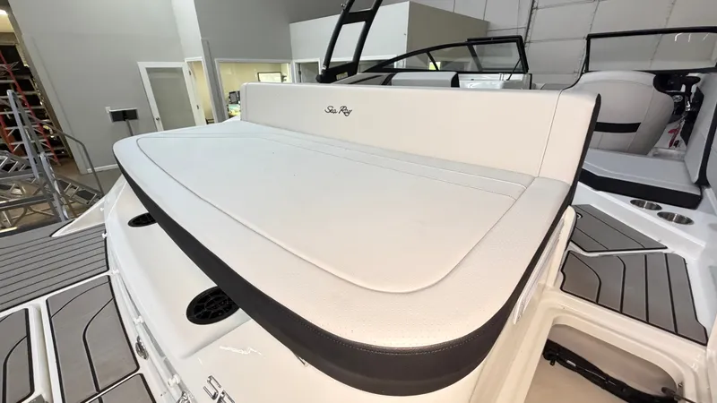 Slide: The Image of The image shows the rear of a 2026 Sea Ray SPX 210 boat with a large sunpad. - 14