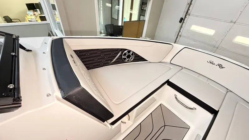 Slide: The Image of Interior of the 2026 Sea Ray SPX 210 with sleek white upholstery and modern detailing. - 49