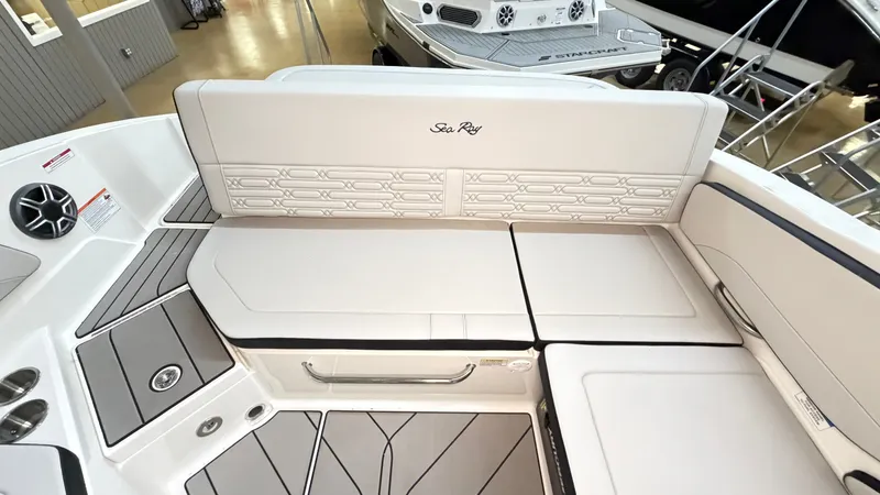 Slide: The Image of The image shows the stern of a Sea Ray SPX 210 boat with sleek upholstery and modern details. - 17