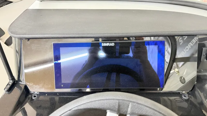 Slide: The Image of Simrad display on the dashboard of a Sea Ray SPX 210 boat. - 38