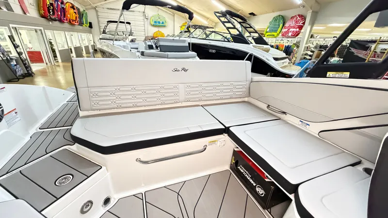 Slide: The Image of The image shows the cockpit of a Sea Ray SPX 210 boat with gray upholstery and modern design. - 16