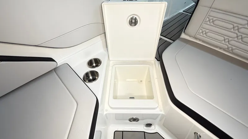 Slide: The Image of The image shows the interior of a Sea Ray SPX 210 boat with an open storage compartment. - 22