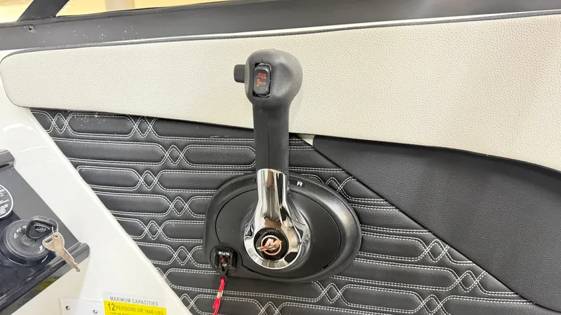 Slide: The Image of Close-up of a Sea Ray SPX 210 boat throttle lever, surrounded by padded panels. - 41