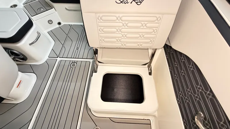 Slide: The Image of Interior of a Sea Ray SPX 210 boat with stylish seating and storage space. - 33