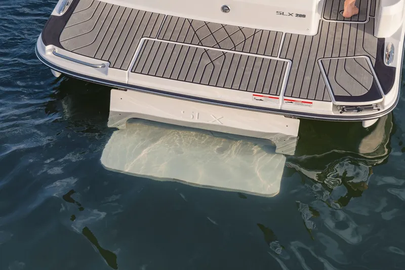 Slide: The Image of The image shows the stern of a 2027 Sea Ray SLX 280 boat in the water. - 19