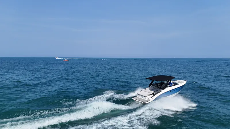 Slide: The Image of A 2027 Sea Ray SLX 280 speeds across the open sea. - 7