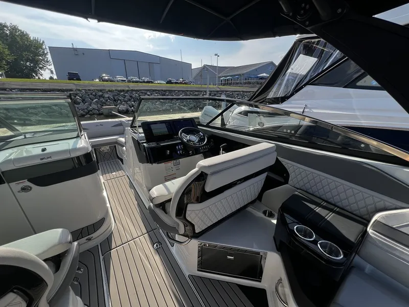 Slide: The Image of The image shows the cockpit of a 2027 Sea Ray SLX 280 with modern seating and controls. - 30