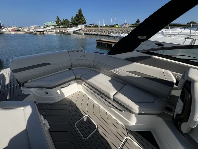 Slide: The Image of The image shows the cockpit of a Sea Ray SLX 280 boat with sleek, gray upholstery. - 26