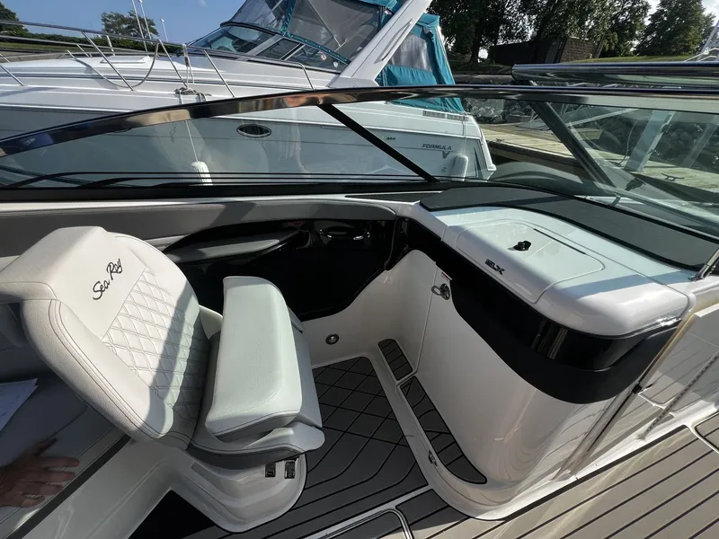 Slide: The Image of The image shows the cockpit of a 2027 Sea Ray SLX 280 with a sleek seat and helm area. - 10