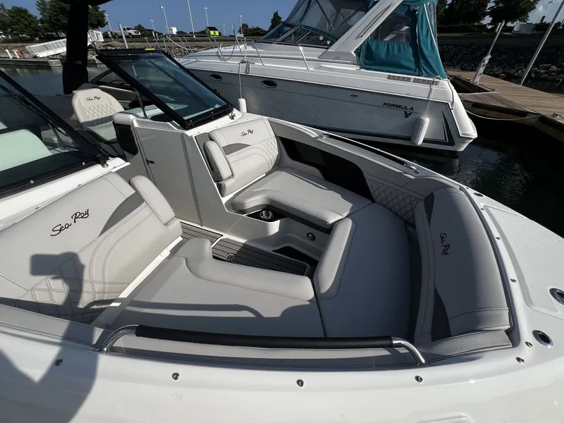 Slide: The Image of The image shows the cockpit of a 2027 Sea Ray SLX 280 boat with sleek gray upholstery. - 22