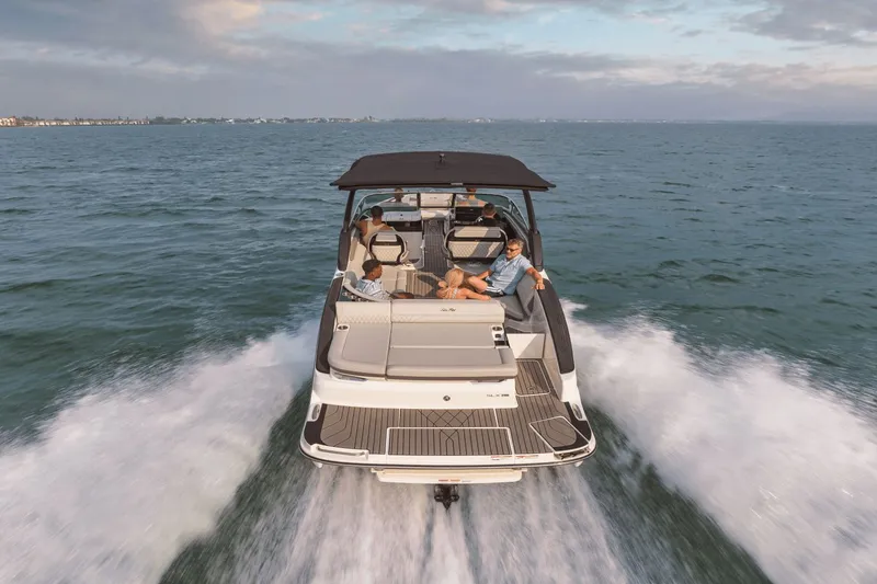 Slide: The Image of A 2027 Sea Ray SLX 280 speeds across the water. Several people relax on board. - 38
