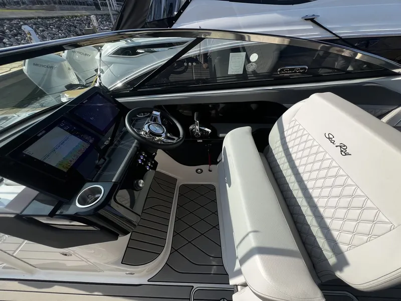 Slide: The Image of The image shows the cockpit of a 2027 Sea Ray SLX 280 with modern instruments and sleek seating. - 13