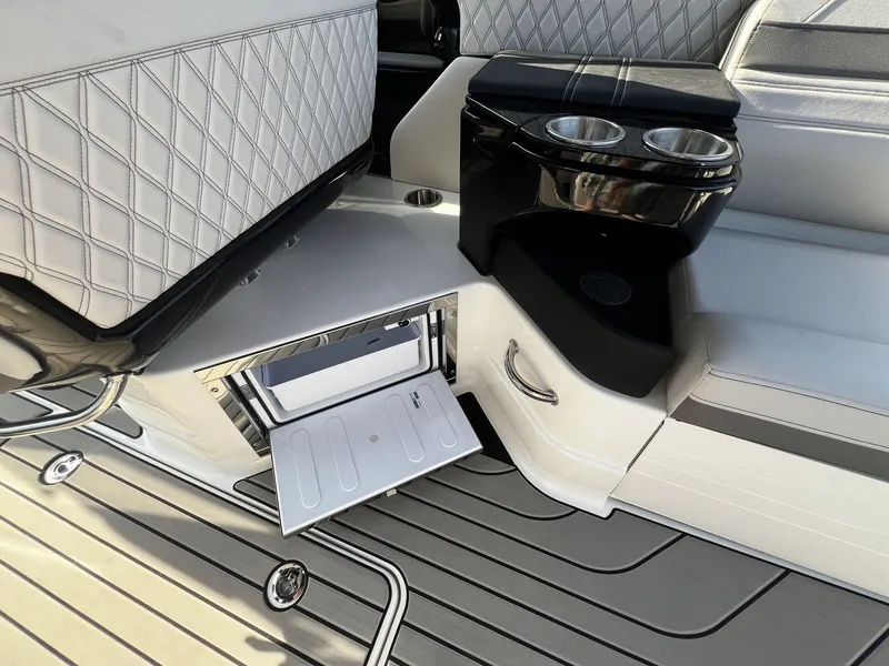 Slide: The Image of The image shows the interior of a Sea Ray SLX 280 boat with sleek seating and a cup holder. - 18