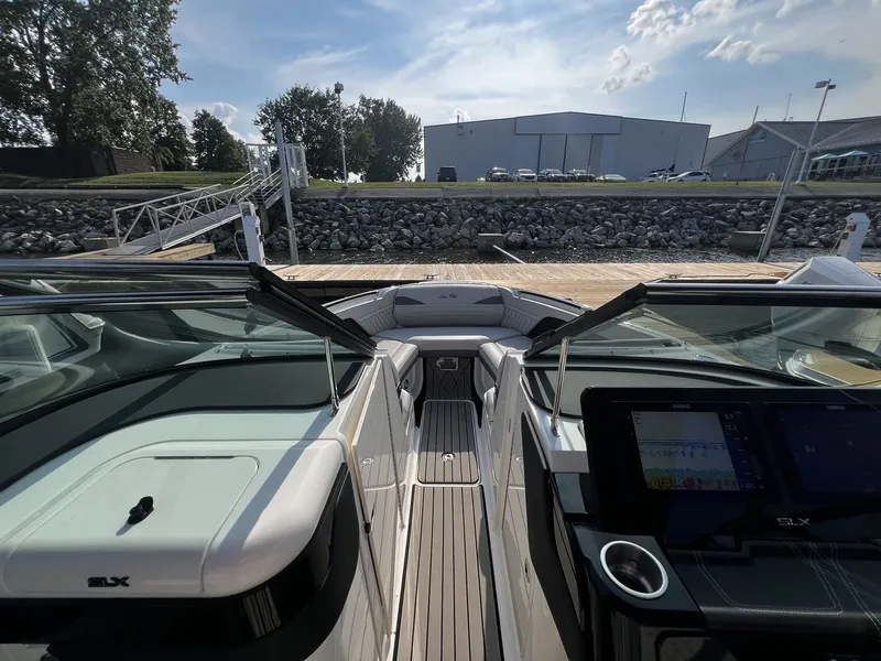 Slide: The Image of The image shows the cockpit of a 2027 Sea Ray SLX 280 boat with modern instruments and sleek design. - 17