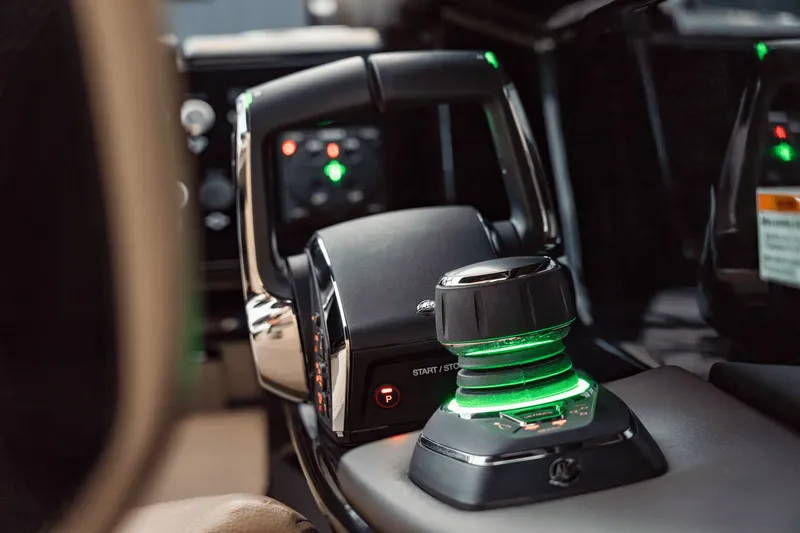 Slide: The Image of Close-up of a Sea Ray SLX 280 boat's control system with illuminated controls. - 11