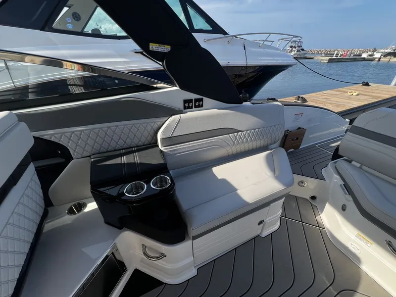 Slide: The Image of The image shows the cockpit of a 2027 Sea Ray SLX 280 with sleek seating and cup holders. - 15