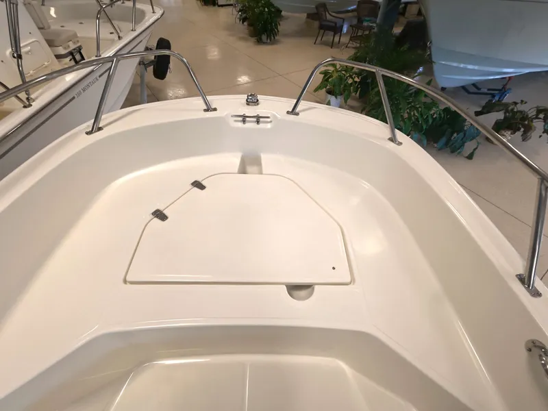 Slide: The Image of The image shows the bow of a 2027 Boston Whaler 160 Super Sport with a clean, white deck. - 14