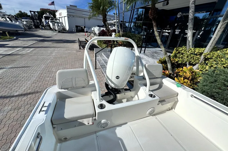 Slide: The Image of The image shows the stern of a Boston Whaler 190 Montauk with an outboard motor. - 9