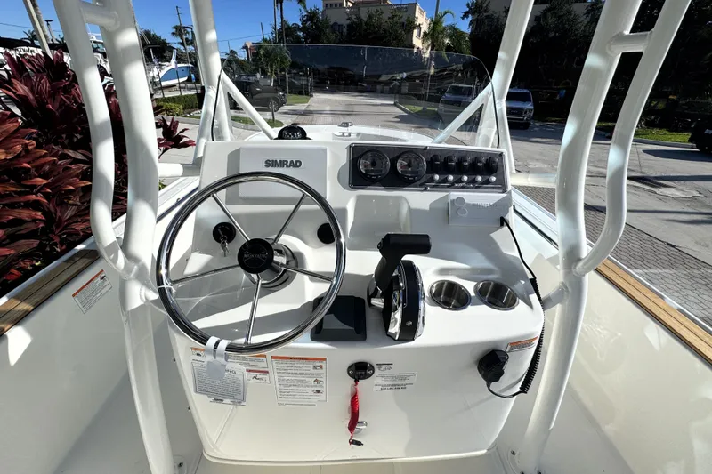 Slide: The Image of The image shows the helm of a Boston Whaler 190 Montauk boat with modern instruments. - 15