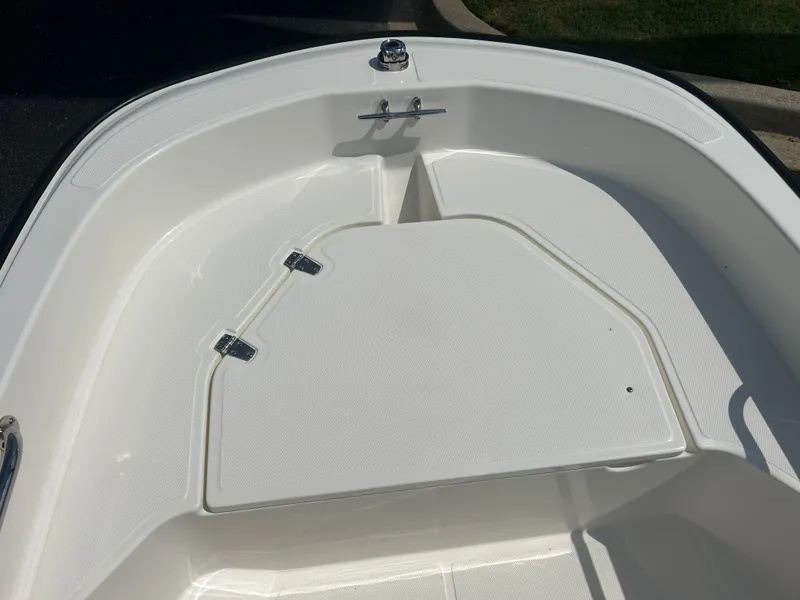 Slide: The Image of The image shows the bow deck of a 2027 Boston Whaler 130 Super Sport with storage. - 9