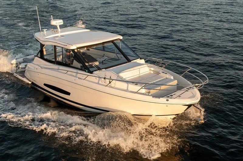 Slide: The Image of 2024 Regal 36 Grande Coupe cruising on open water, showcasing sleek design and luxury features. - 25