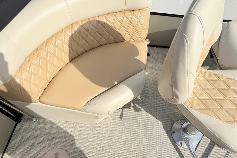 Slide: The Image of 2019 South Bay S224SB225 boat interior with beige quilted seating and carpeted floor. - 10