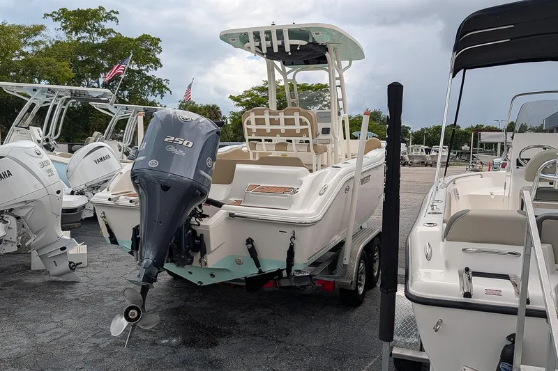 Slide: The Image of 2019 Key West 239 FS boat with Yamaha 250 engine, displayed in a marina. - 3