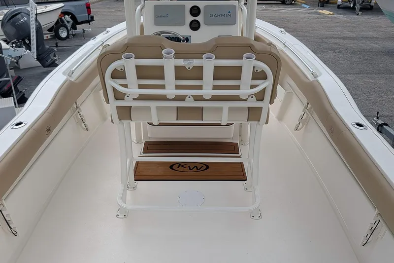 Slide: The Image of 2019 Key West 239 FS boat interior with Garmin system and cushioned seating. - 9