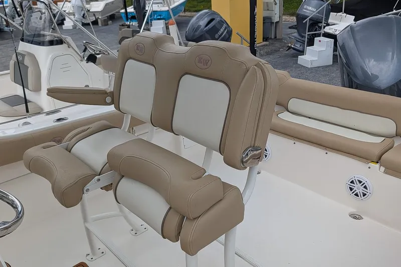 Slide: The Image of 2019 Key West 239 FS boat interior with beige and white seating. - 10