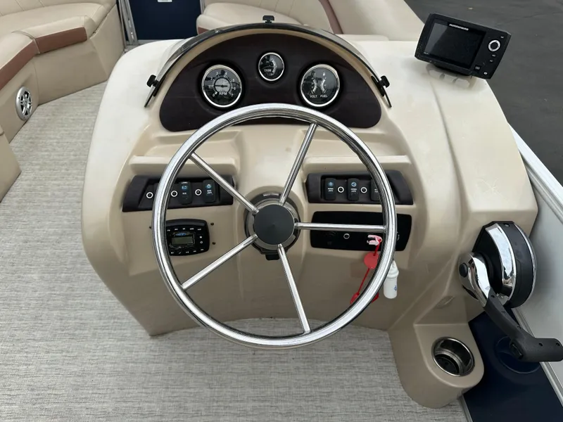 Slide: The Image of Helm of a 2018 South Bay S224CR with steering wheel and gauges. - 10