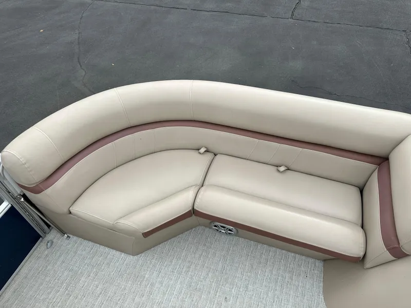 Slide: The Image of The image shows a beige and brown seating area on a boat. - 6