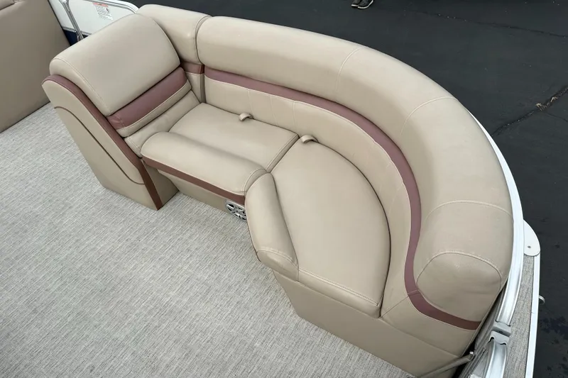 Slide: The Image of Beige upholstered seating on a boat with brown accents. - 21